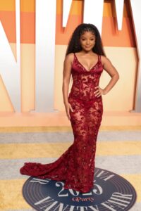 Amazing : Halle Bailey Dons Sheer Red Dress and Louboutin Open-Toe Sandal for Vanity Fair’s 2025 Oscars After Party